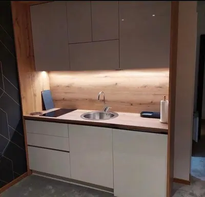 a kitchen counter with a sink and a mirror at Lukić Apartmani in Kopaonik