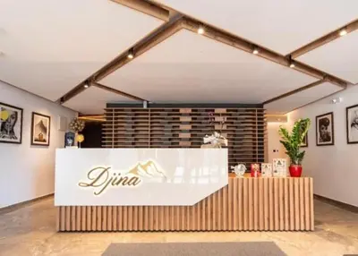 a restaurant with a sign on a counter in a room at Lukić Apartmani in Kopaonik