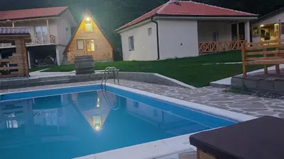 a swimming pool in the backyard of a house at ETNO Selo STRAŽA in Pirot