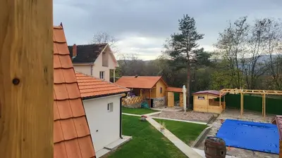 a view of a backyard with houses and a yard at ETNO Selo STRAŽA in Pirot