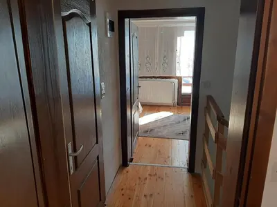 a hallway with an open door to a room at Vikend kuća Vukašinović in Kopaonik