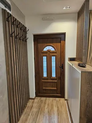 a wooden door in a room with a counter at Dajoda Lux - free Spa in Kopaonik