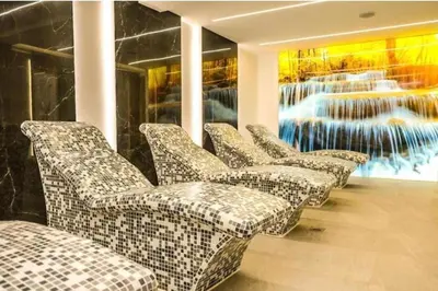 a row of chairs in a room with a painting at Dajoda Lux - free Spa in Kopaonik