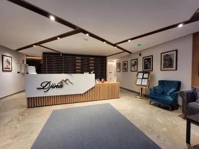 a room with two chairs and a counter in a room at Three Pearls in Kopaonik