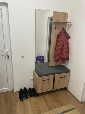 a dressing room with a mirror and a wooden dresser at Konstantin Sokobanja in Soko Banja