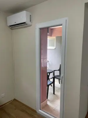 a door to a room with a window and a table at Konstantin Sokobanja in Soko Banja