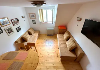 a living room with a couch and a flat screen tv at Brzeće - Bele staze Nikola in Brzeće