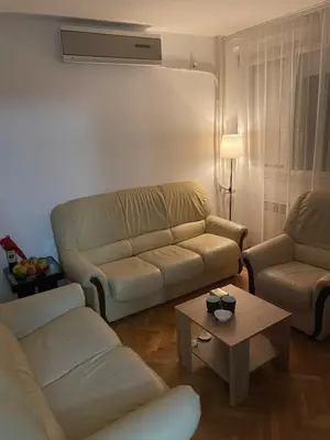 a living room with a couch and a coffee table at Dora apartment in Niš