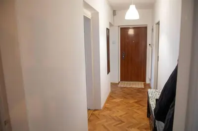 a hallway with a hallway leading to a door at Dora apartment in Niš