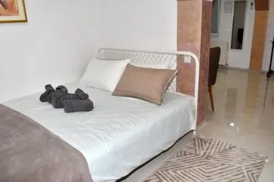 a bed with stuffed animals on it in a room at Grof apartmani in Zaječar