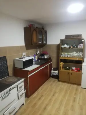 a small kitchen with a stove and a refrigerator at Vila Budimir in Pirot