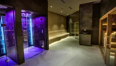 a hallway with purple lights in a building at Woodside Kopaonik By Gogic in Kopaonik