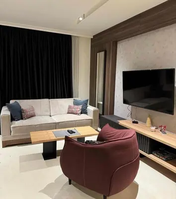 a living room with a couch and a table at Woodside Kopaonik By Gogic in Kopaonik