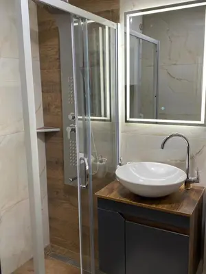 a bathroom with a sink and a glass shower at Bele Staze 3a Kopaonik, Brzece in Kopaonik