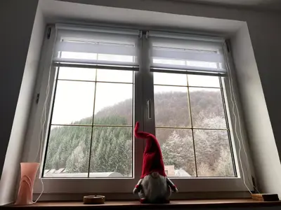 a santa hat is sitting on a window sill at Bele Staze 3a Kopaonik, Brzece in Kopaonik