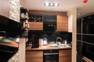 a kitchen with a sink and a counter at Apartman W Residence in Kopaonik