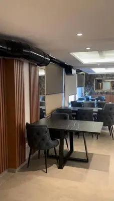 a conference room with a table and chairs at President Kop Fibi in Kopaonik
