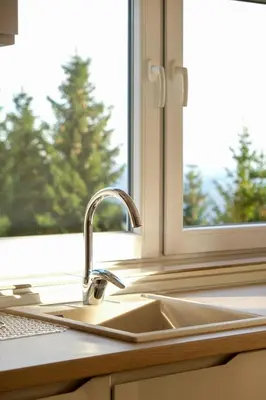 a kitchen sink in front of a window at Vila Kruna Sunčani Breg in Kopaonik