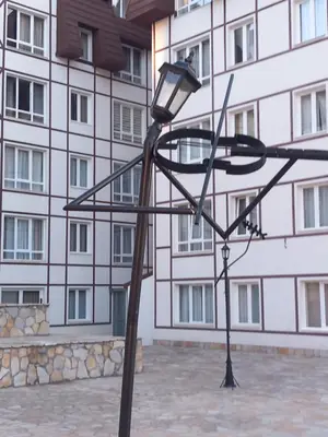a street light in front of a building at Apt. Kop for you in Kopaonik