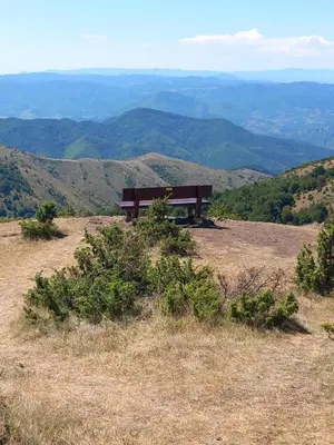 a bench sitting on the top of a hill at Apt. Kop for you in Kopaonik