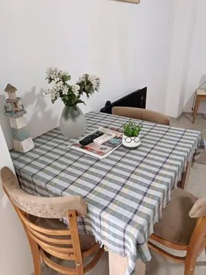 a table with a vase of flowers on top of it at Adamovic in Pirot