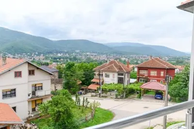 a view of a town with mountains in the background at Apartman Ivanka in Soko Banja