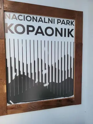 a sign for a krocagonisk sign on a wall at MASSIV Kopaonik centar lux apartmani in Kopaonik