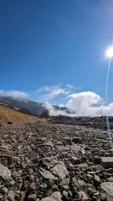 a rocky field with the sun in the sky at Studio Čuvarkuća in Kopaonik
