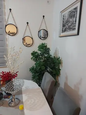 a dining room with a table and two lights at Viva Lux in Soko Banja