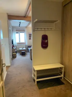 a living room with a bench in a room at Apartment Župa 111 - Župa, Kopaonik in Kopaonik