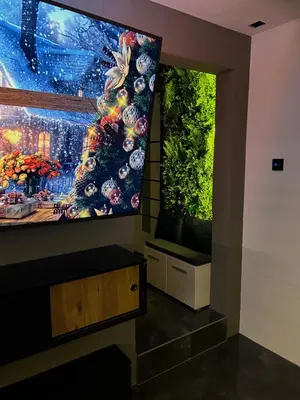 a large flat screen tv hanging on a wall at Beta Lux in Zaječar