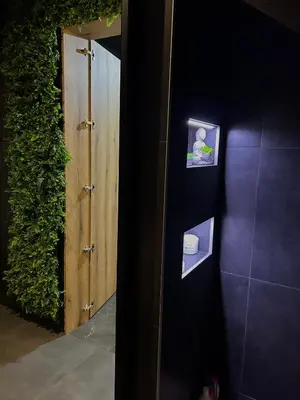 a room with a door with pictures on the wall at Beta Lux in Zaječar