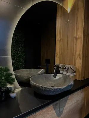 a bathroom with two sinks and a large mirror at Beta Lux in Zaječar