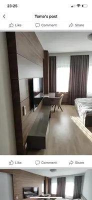 a room with a mirror and a bed and a desk at Hotel Rile Men Blue in Niš