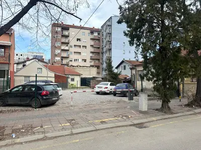 a group of cars parked in a parking lot at Hotel Rile Men Blue in Niš