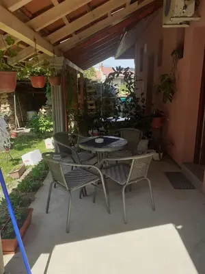 a patio with a table and chairs on a patio at Apartman Leggiero in Vrnjačka Banja