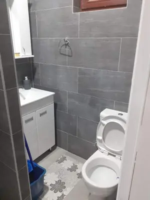 a bathroom with a toilet and a sink at Apartman Leggiero in Vrnjačka Banja