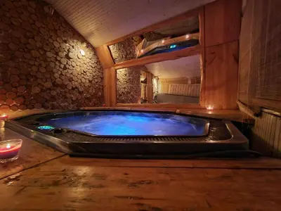 a large jacuzzi tub in a room at Ski hotel DOBRODOLAC in Kopaonik