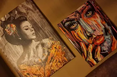 two paintings of a woman are hanging on a wall at Supreme studio in Niš