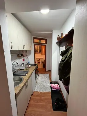 a small kitchen with a sink and a counter at Apartman Cogan - 100m from Gondola - Brzece in Kopaonik