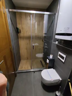 a bathroom with a shower and a toilet at Vidik Dream Kopaonik in Kopaonik