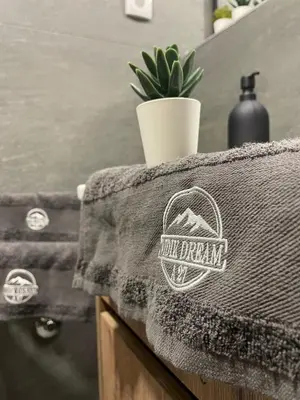 a sticker on a table with a plant on it at Vidik Dream Kopaonik in Kopaonik