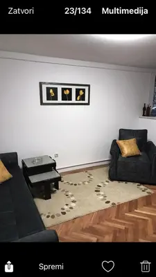 a living room with a couch and a table at GOČ Planinska Kuća MILJA in Kraljevo