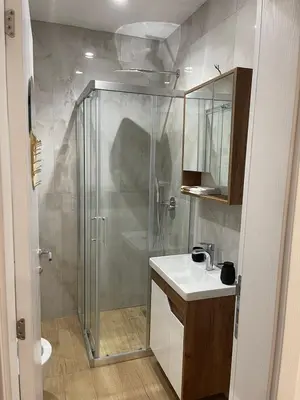 a bathroom with a shower and a sink at Apartment in Vila dr Milovan in Vrnjačka Banja