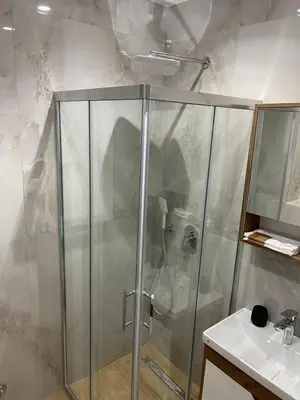 a shower with a glass door in a bathroom at Apartment in Vila dr Milovan in Vrnjačka Banja