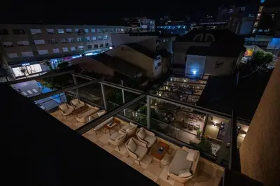 an overhead view of a city at night with couches at Hotel & Restaurant Ponte Bianco in Vranje