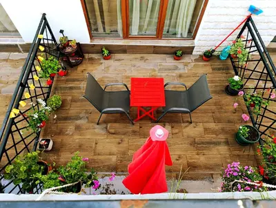 an overhead view of a patio with a red table and chairs at President Kop Apartman 106 in Kopaonik