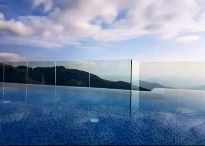 a swimming pool with a view of the mountains at Apartmani L6 & P90 Milmari Kopaonik in Kopaonik