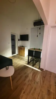 a living room with a couch and a table at Apartman GreenPine in Soko Banja