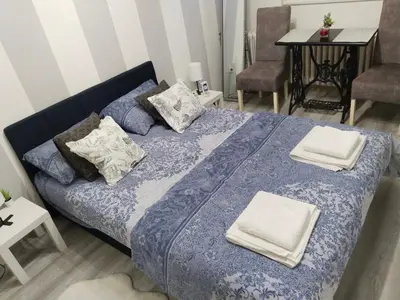 a bedroom with a bed with two pillows on it at Studio apartman Nataly in Kruševac